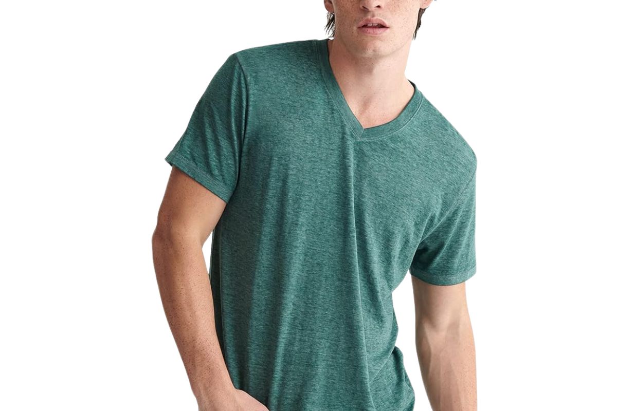 A guy wearing a green color burn out T Shirt