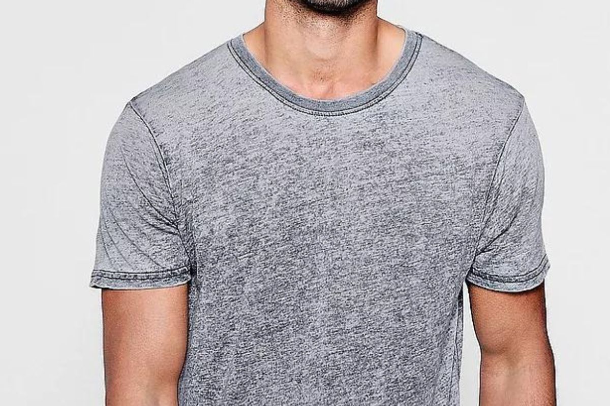 A guy wearing a grey color burnout t shirt