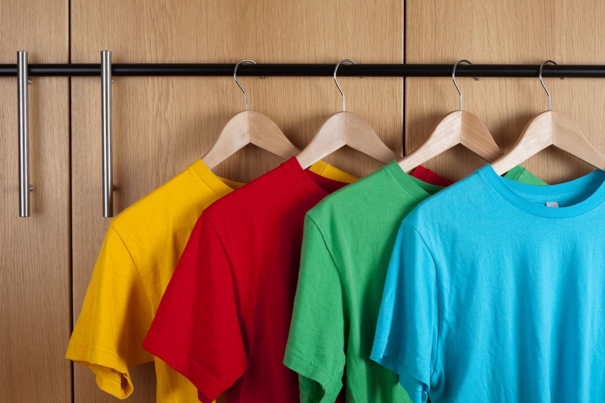 A set of four 100 % cotton t shirt shown in the image.