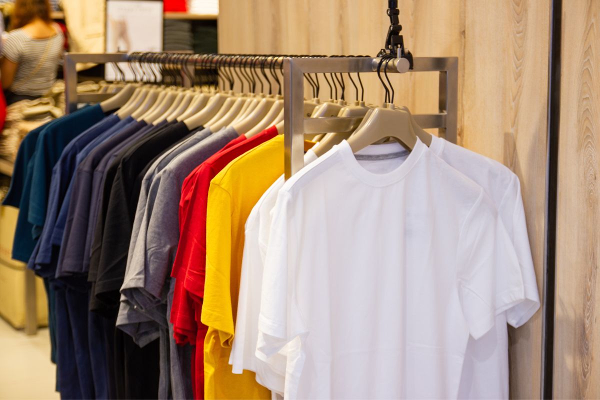 Various colors of the largest t shirt sizes are displayed in the store