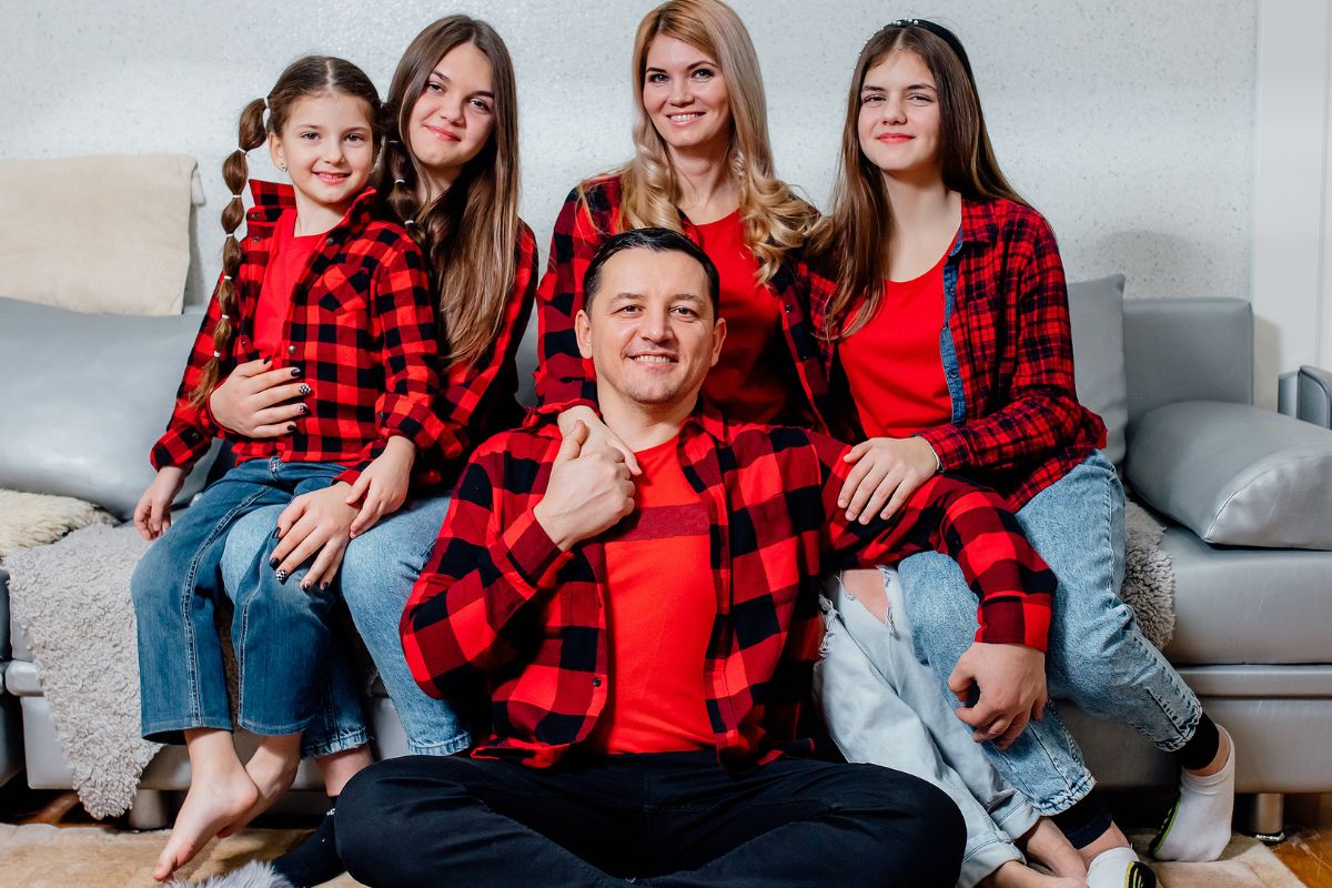 family dressed in matching shirts of the same color and style