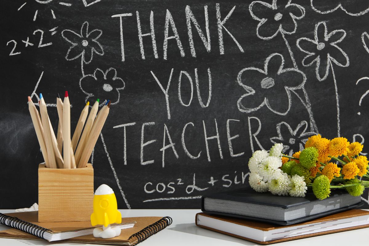 A collection of gifts for the teacher kept on the desk.