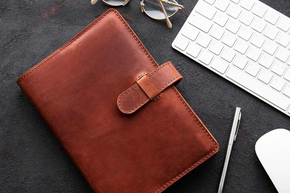 A leather notebook on a office table for the lady boss
