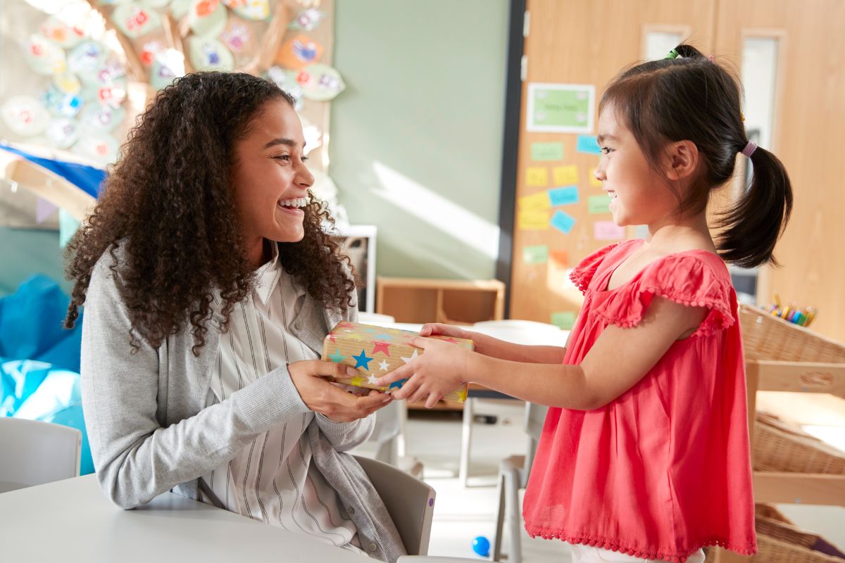 A student giving gift to her teacher