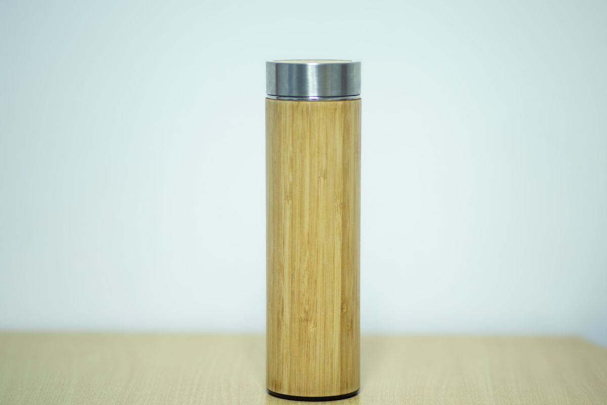 A wooden water bottle shown in the image a sustainable gift for employee