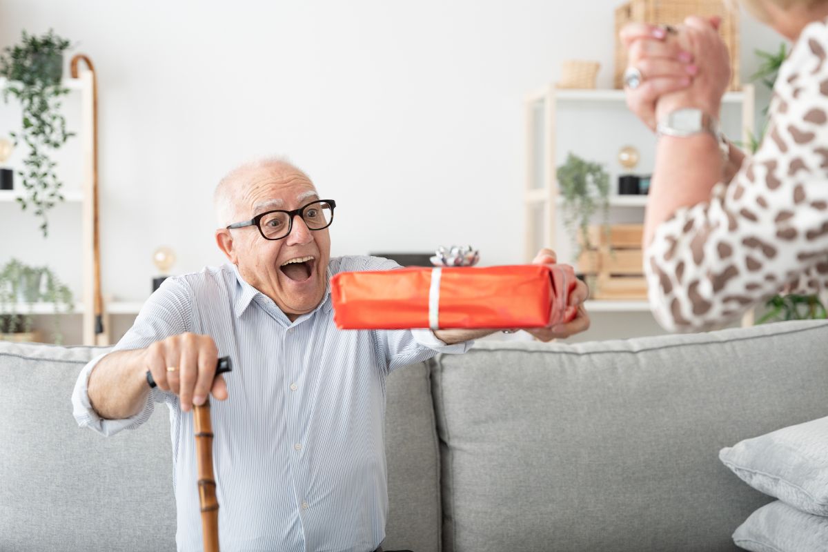 An old man is getting a get well soon gift