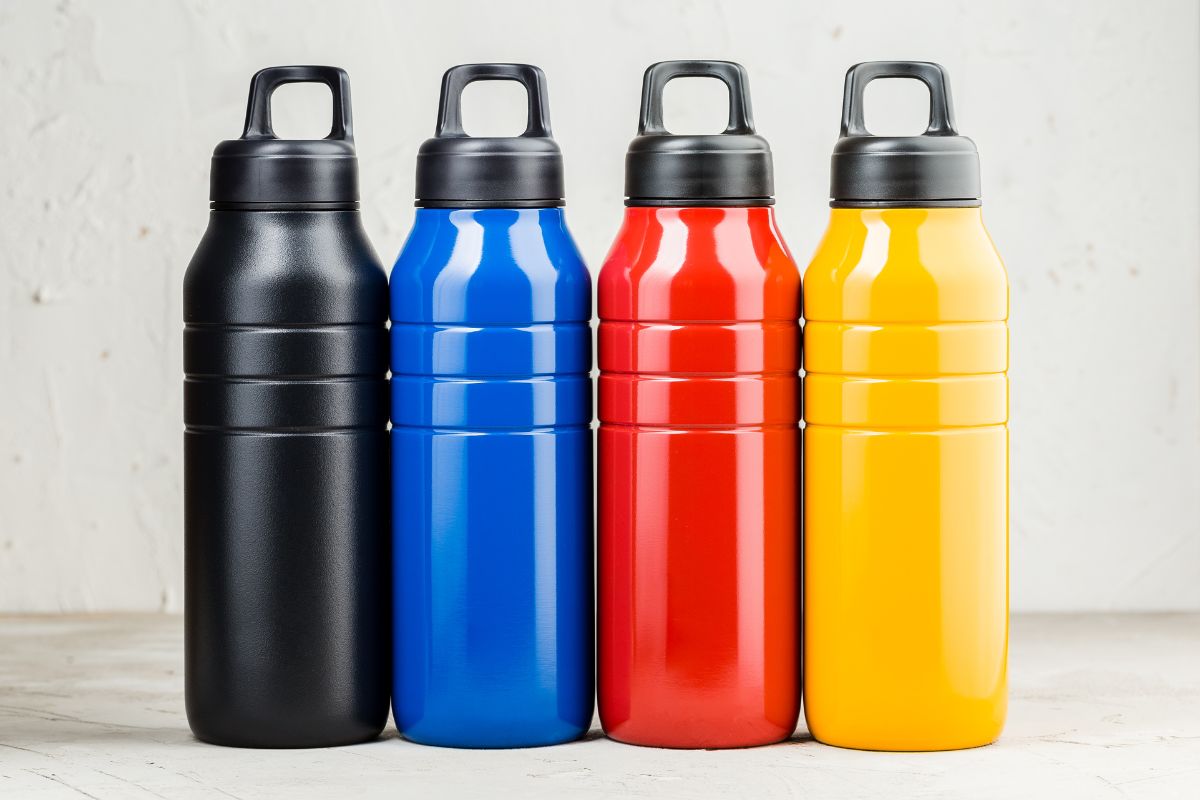 Different colored water bottles kept together