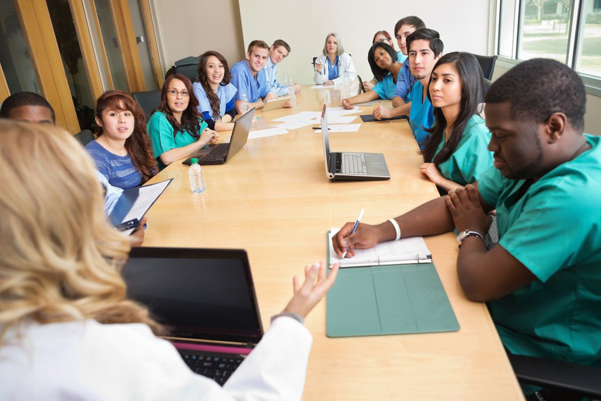 Hospital staff together in a meeting for more team collaboration