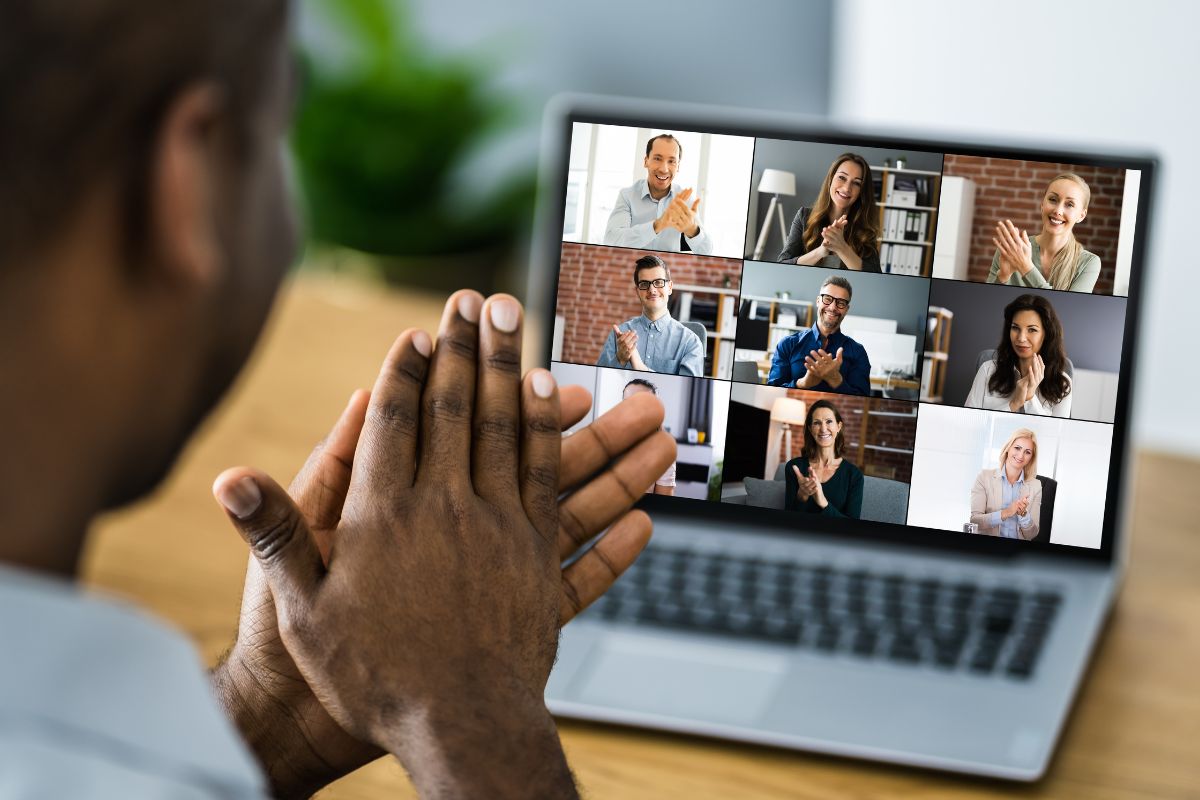 Office employees participating in an office meeting virtually together