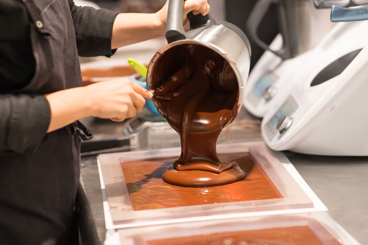 A baker making chocolate milk goods for a corporate present for a business