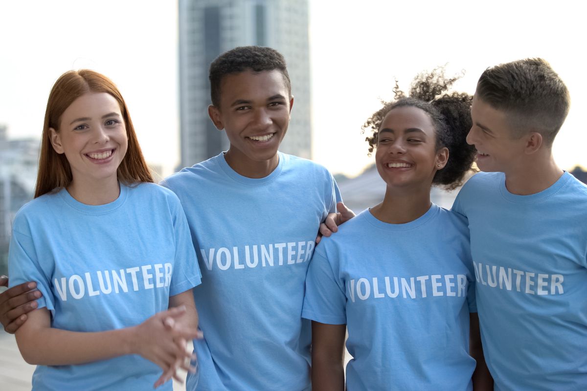 A group of volunteer wearing similar print on demand t shirt.