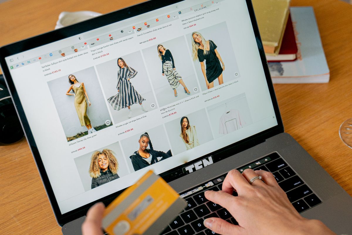 A lady buying trending dresses for her through online shopping.