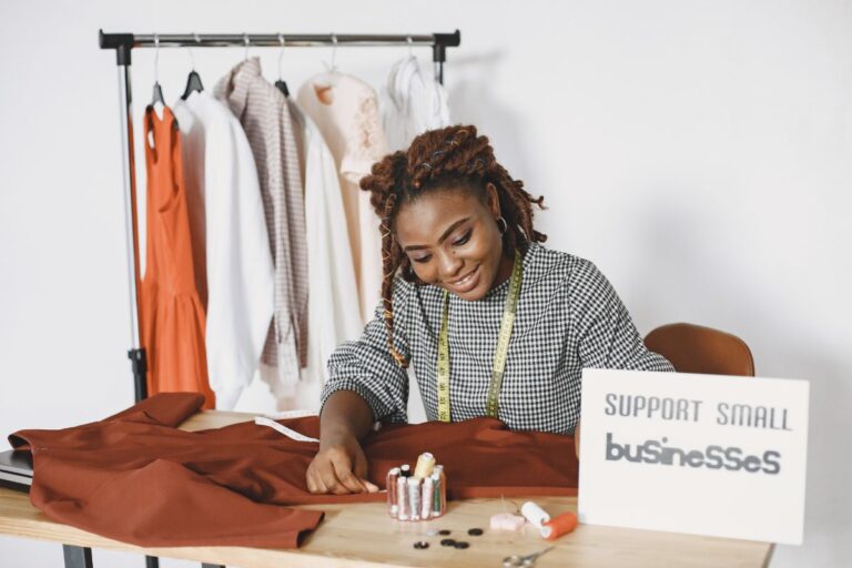 A lady working on her clothing design from home.