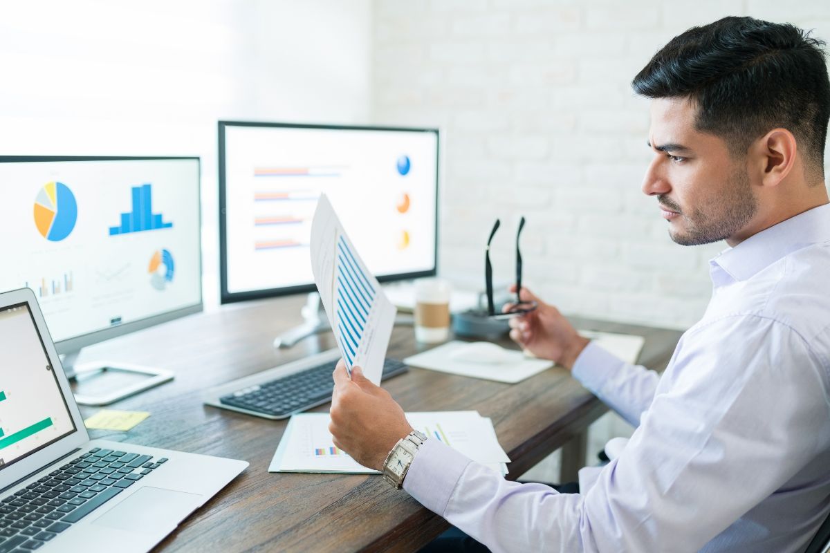 A man analyzing sales data of his print on demand products