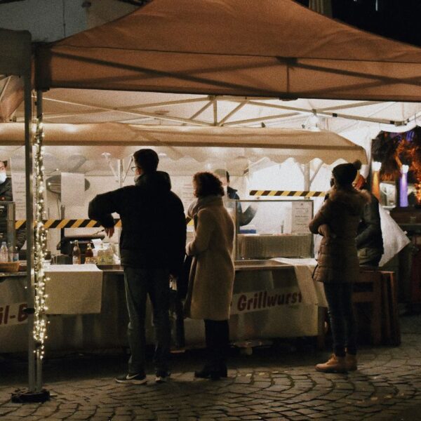 A salesman selling his products in a holiday market to boost sale.