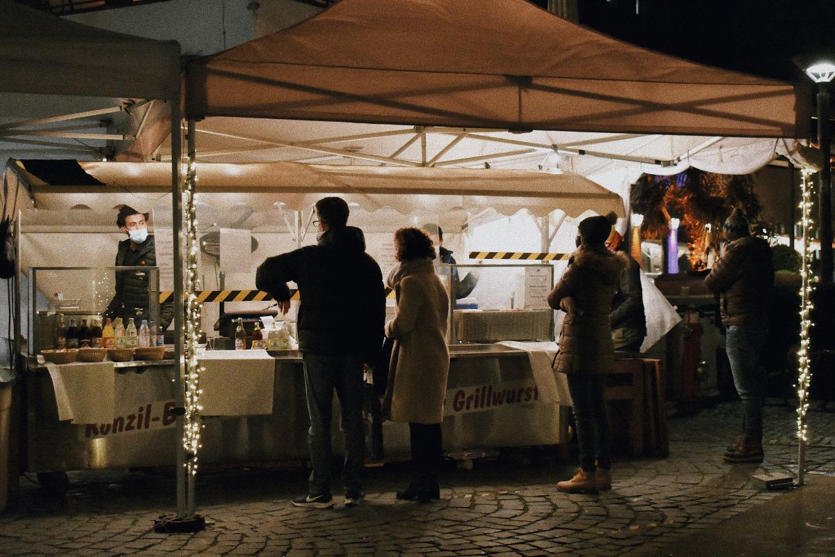 A salesman selling his products in a holiday market to boost sale.