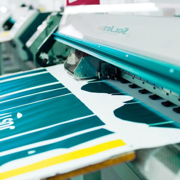 A sublimation printer printing on a fabric.