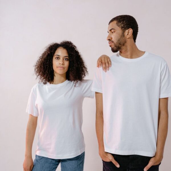 Two friends wearing same t shirt.