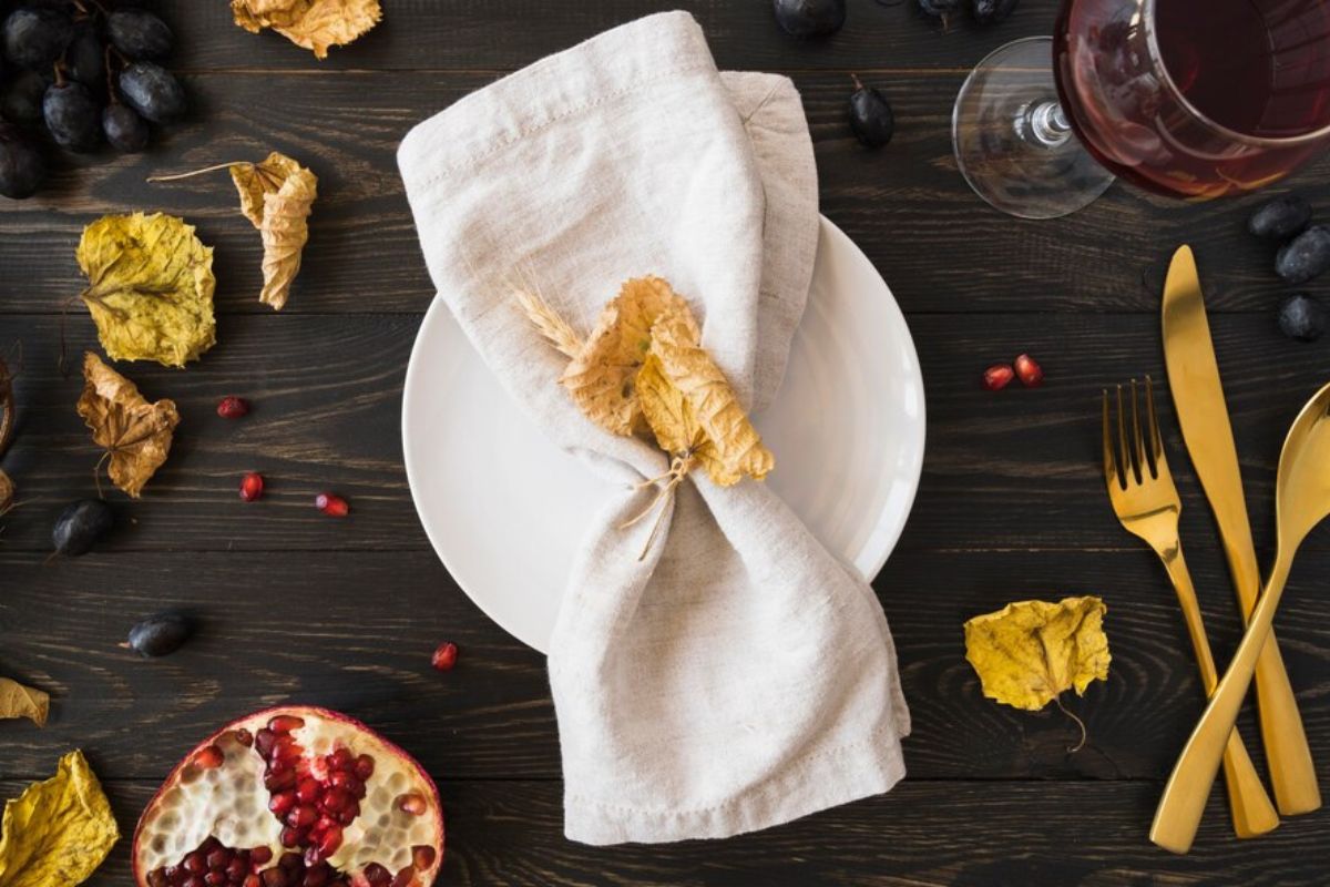 A napkin made from cotton kept above a plate.