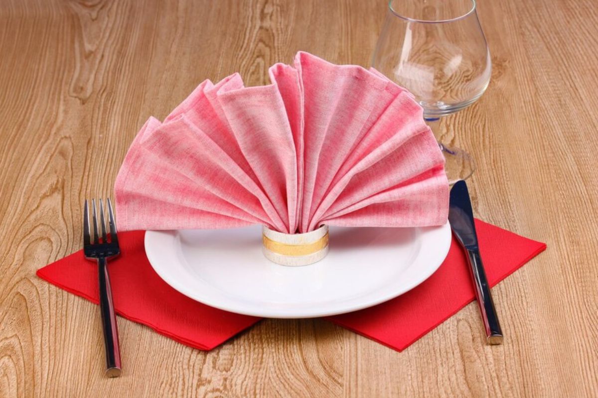 Classic fan fold napkin design shown in the image.