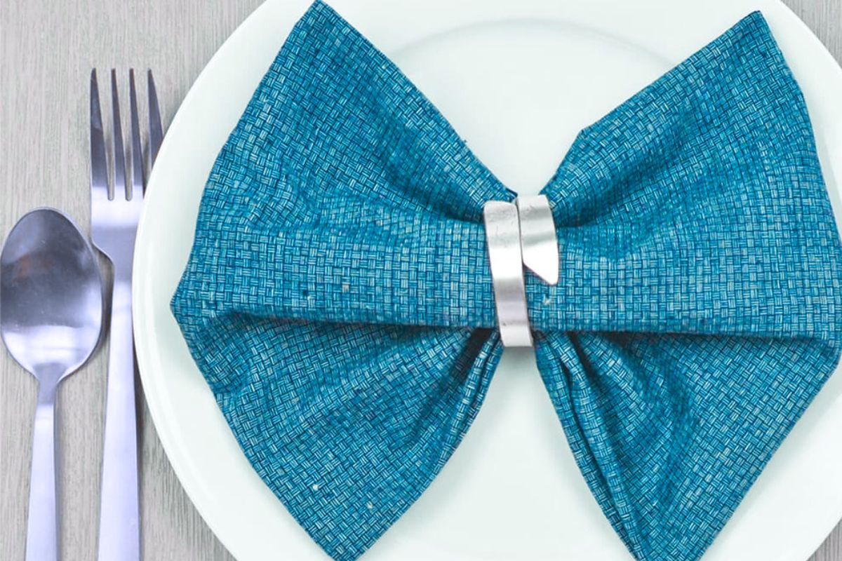 The bow tie fold napkin design shown in the image.