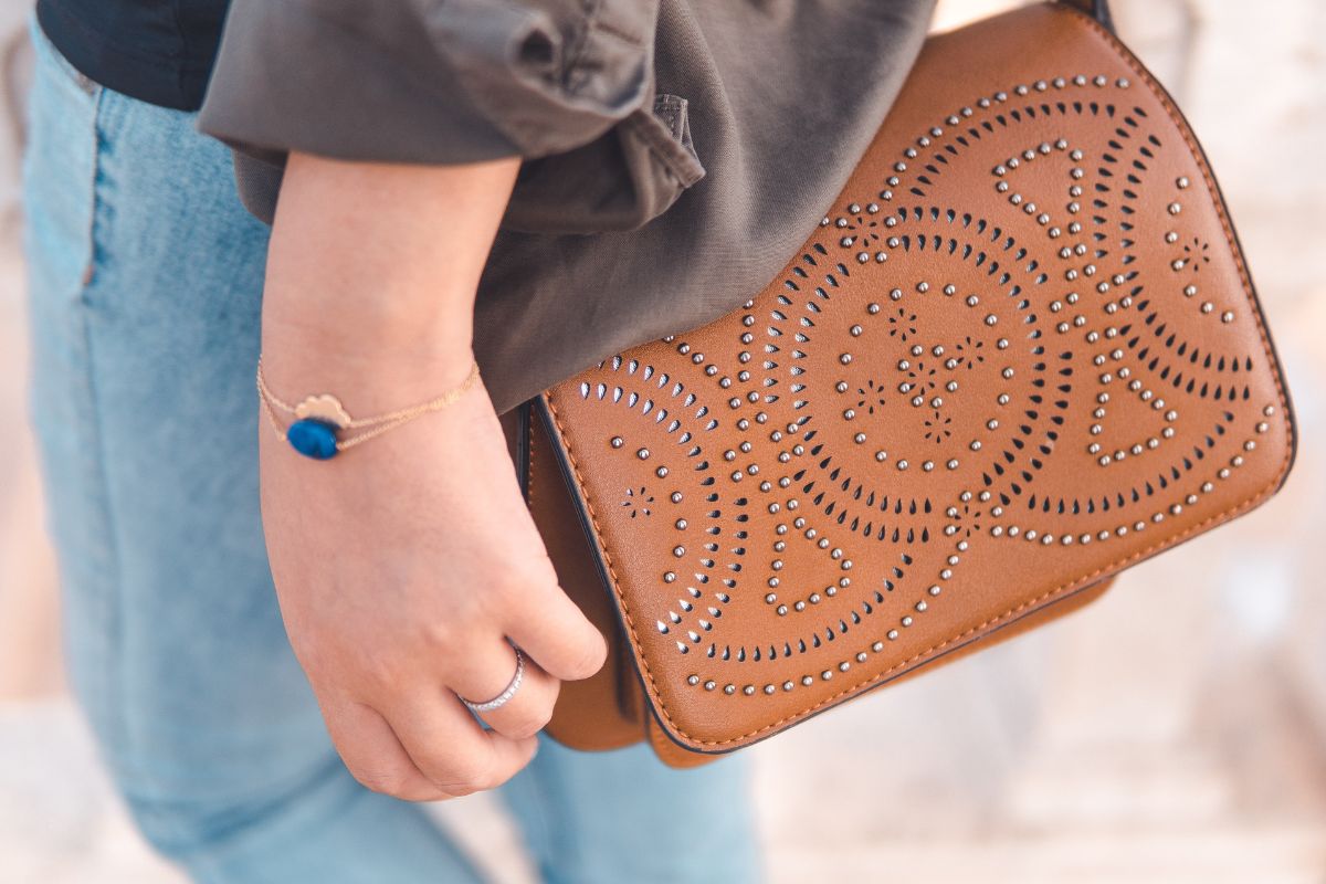 A lady holding stylish customized bag with her