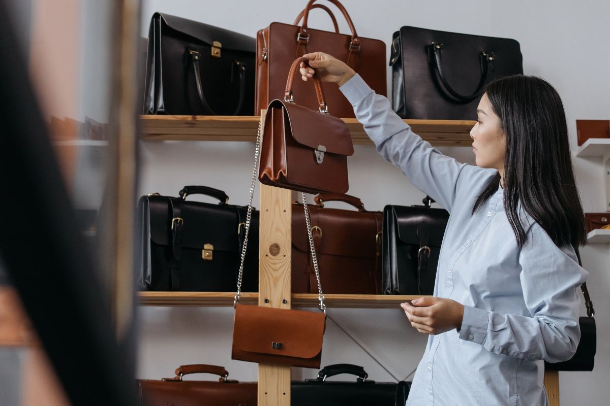 A lady shopping for leather bags to customized it and sell further